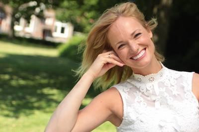 A smiling woman in the park