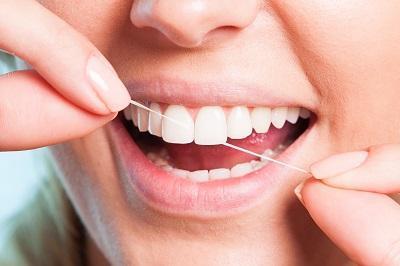 close up of person flossing in Vancouver