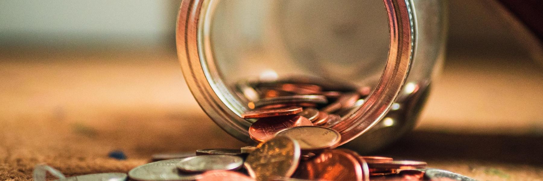 Money Spilling out of a Jar
