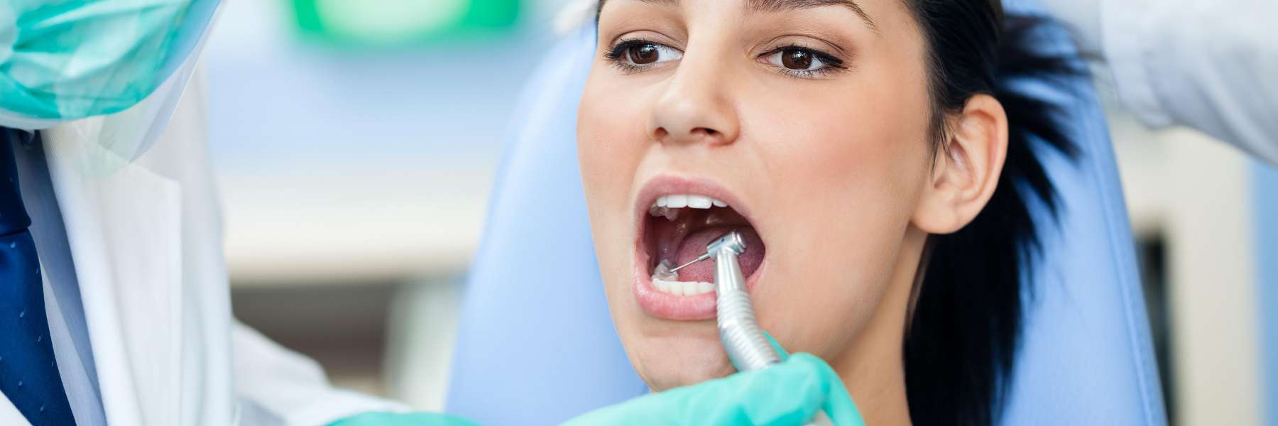 A woman getting a dental cleaning | dentist Vancouver BC