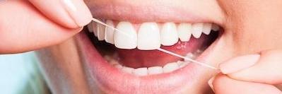 A woman flossing