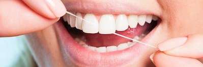 A woman flossing