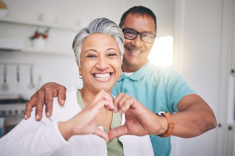 couple using hands to make a heart