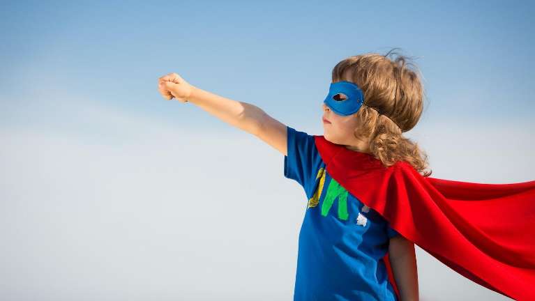 A child wearing a superhero costume