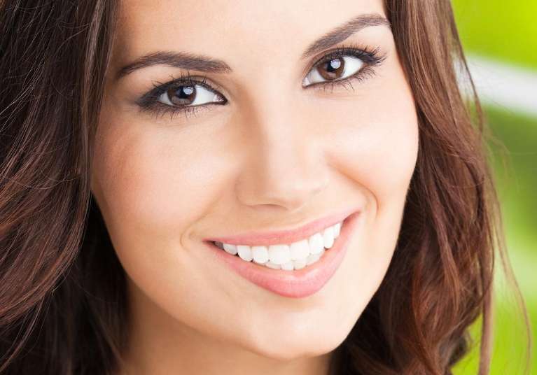 A smiling woman with Botox in Vancouver