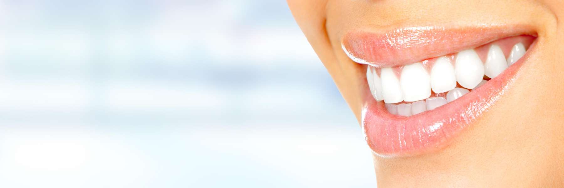 A smiling woman with white teeth