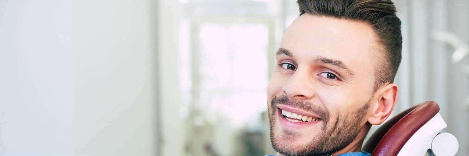 man smiling in dental chair