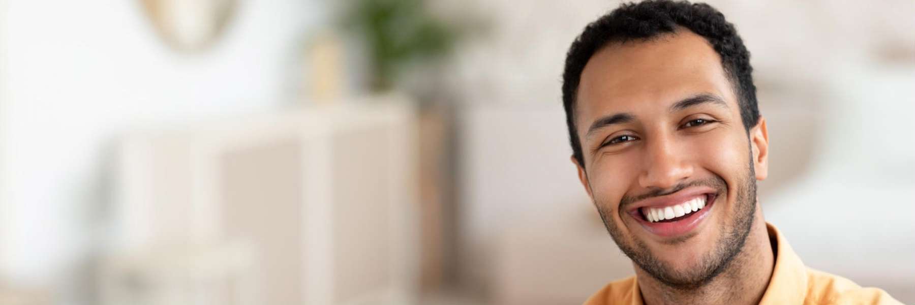 man smiling after getting teeth whitened